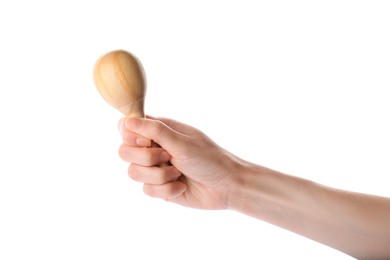 Photo of Woman holding wooden maraca on white background, closeup. Musical instrument
