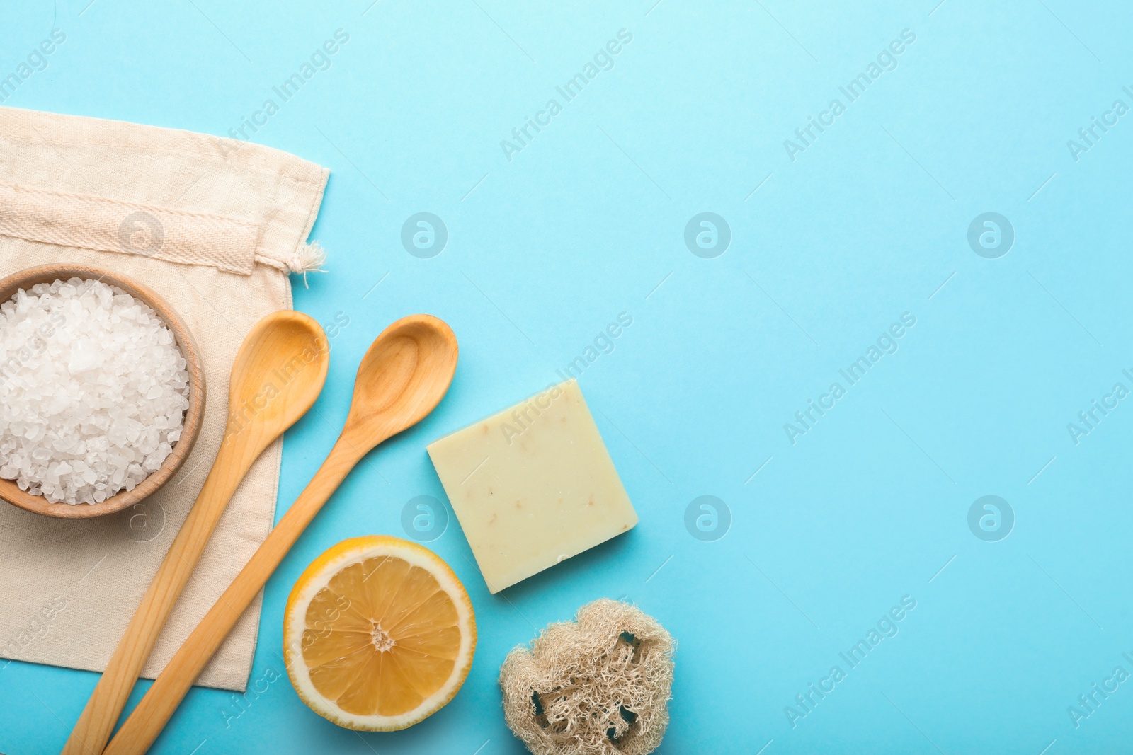 Photo of Flat lay composition with eco friendly products on turquoise background, space for text