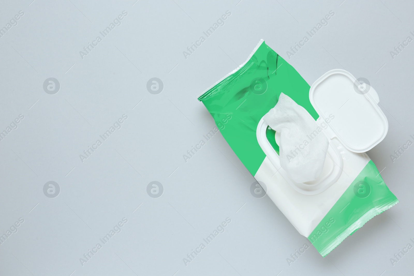 Image of Wet wipes flow pack on light grey background, top view. Space for text