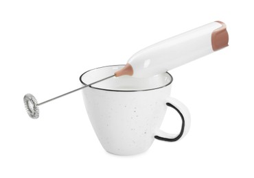 Photo of Milk frother wand and cup isolated on white