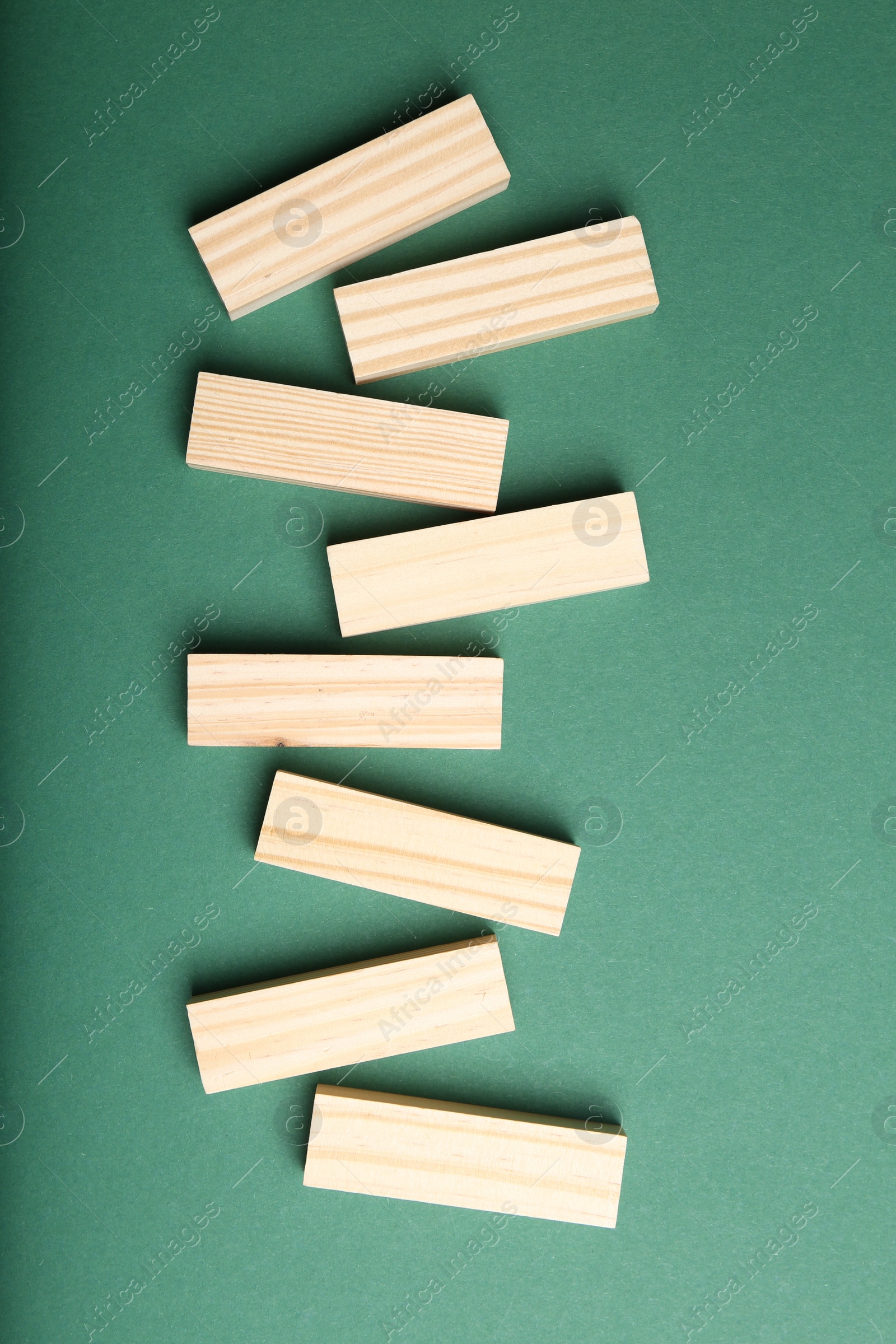 Photo of Wooden blocks with word KEYWORDS on green background, flat lay