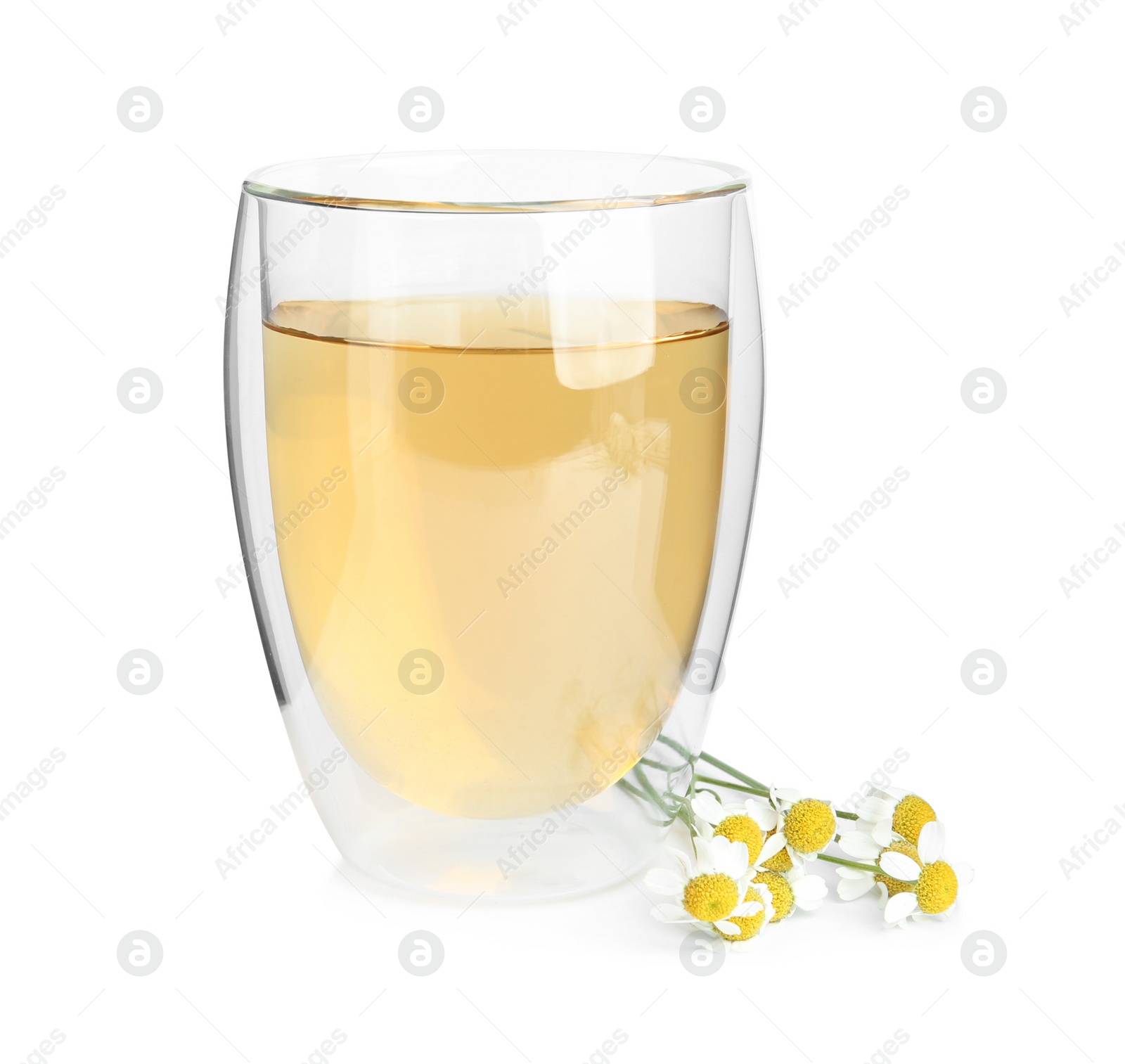 Photo of Delicious chamomile tea in glass isolated on white