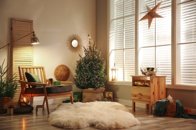 Photo of Stylish room interior with elegant Christmas decor