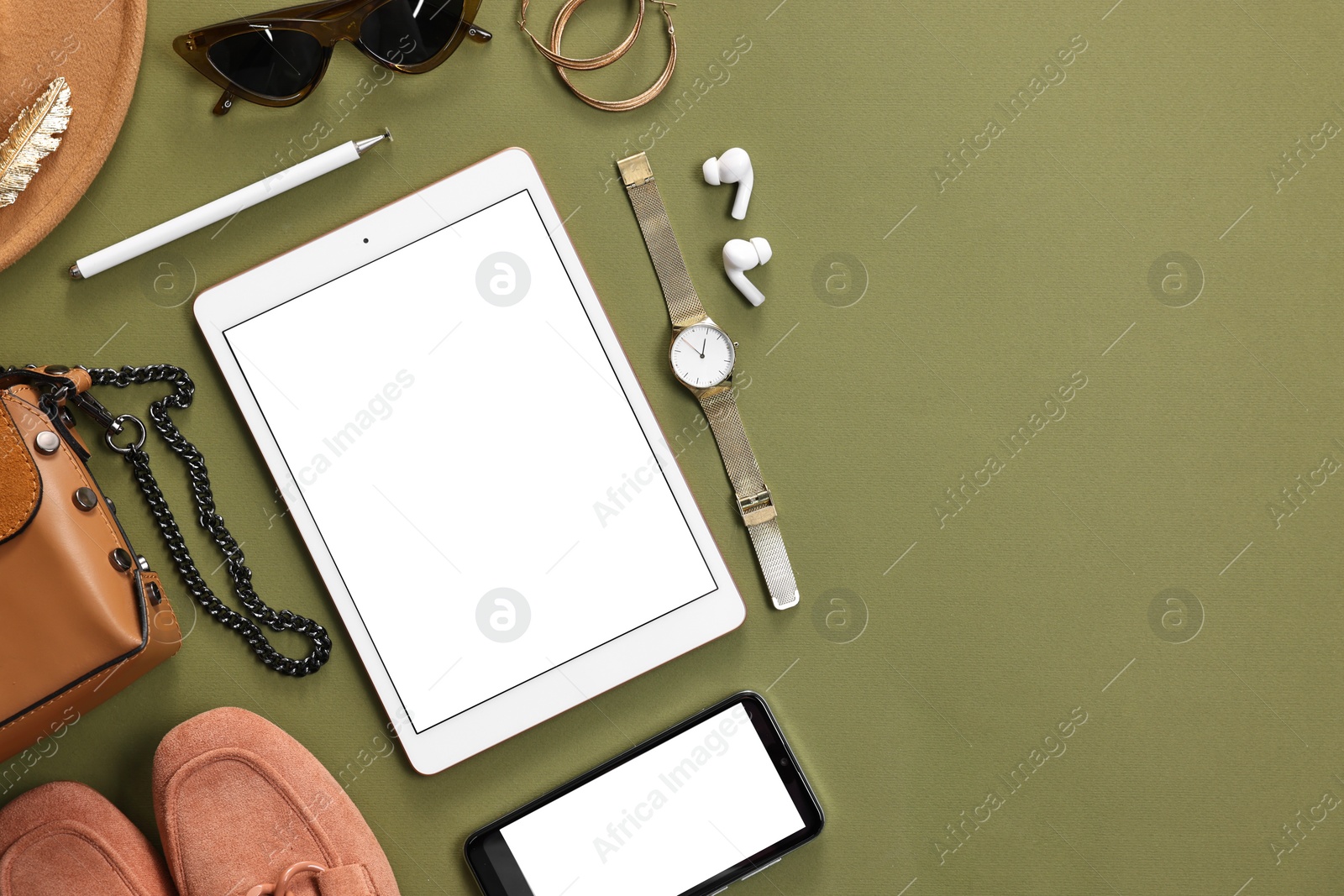 Photo of Flat lay composition with modern tablet on olive background. Space for text