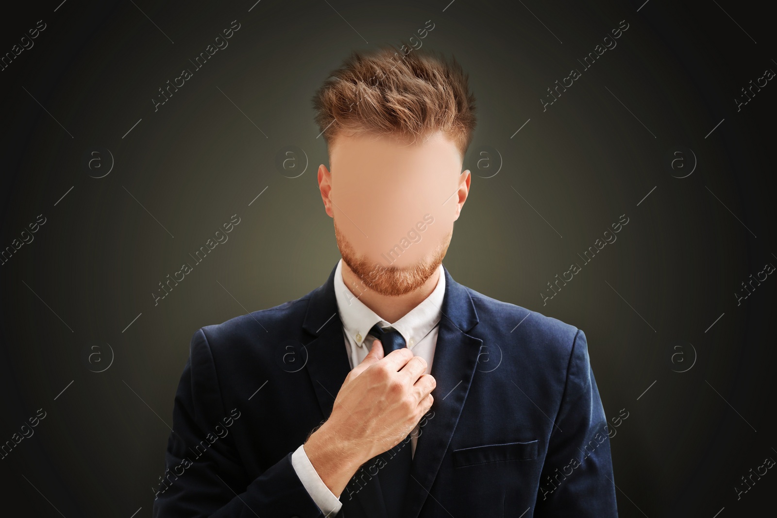 Image of Anonymous. Faceless man in suit on dark background