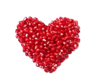 Heart made of tasty pomegranate seeds on white background, top view