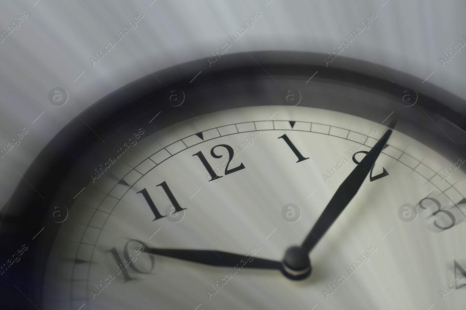 Image of Closeup view of clock, motion blur effect. Time concept