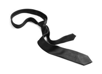 Photo of One black necktie isolated on white. Men's accessory