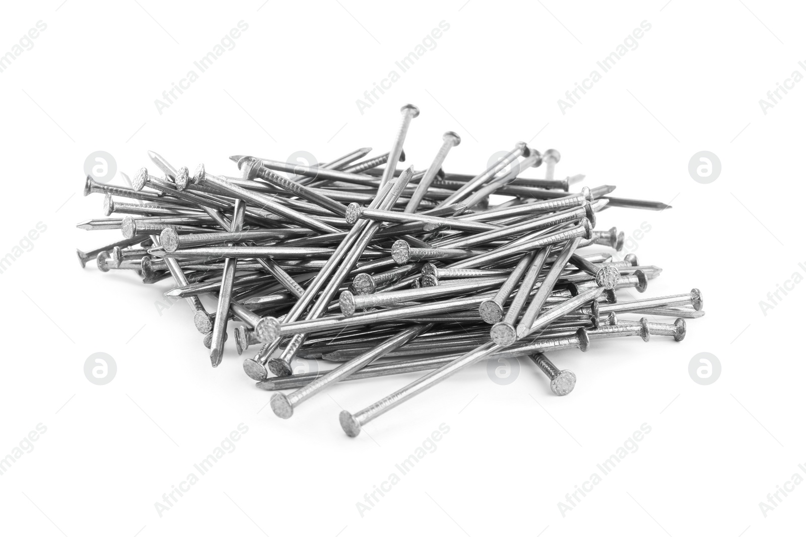 Photo of Pile of metal nails on white background