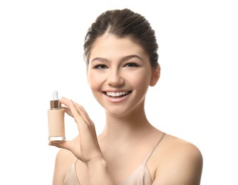 Photo of Beautiful girl with bottle of foundation on white background