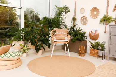 Photo of Room interior with stylish furniture and green plants