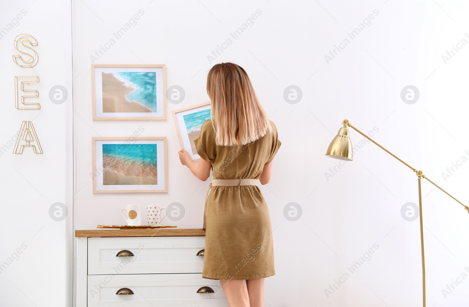 Photo of Young interior designer at work in modern room