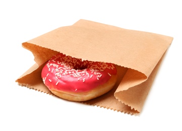 Photo of Paper bag with donut on white background. Space for design