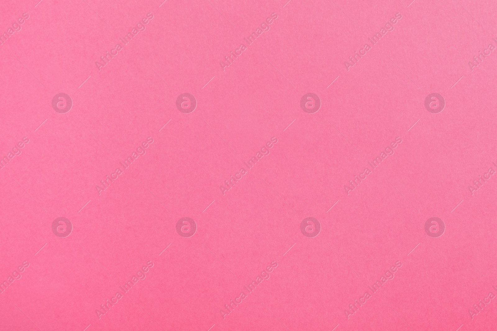 Photo of Pink paper sheet as color background, top view