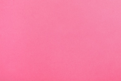 Photo of Pink paper sheet as color background, top view