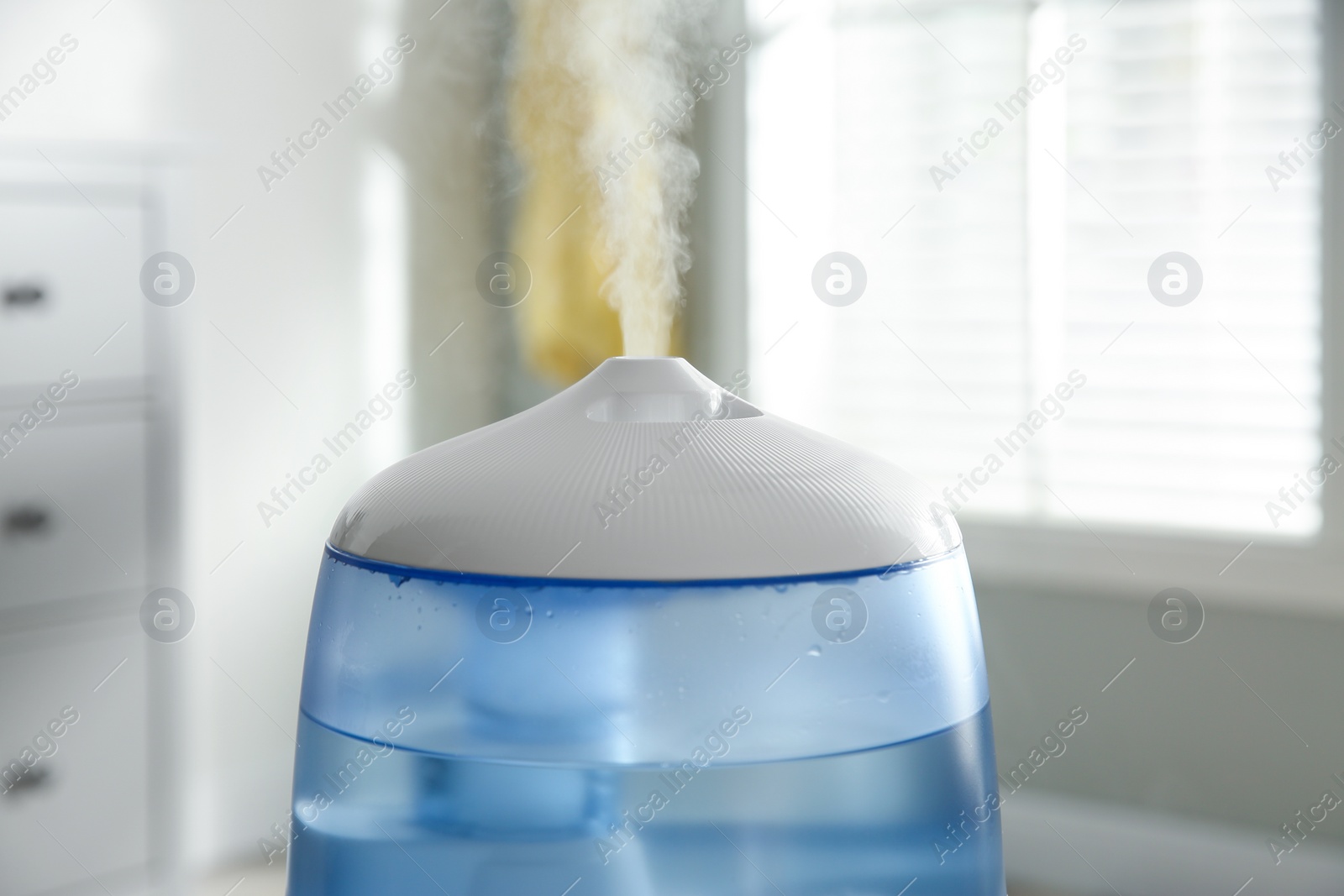 Photo of Modern air humidifier at home, closeup view