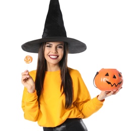 Photo of Beautiful woman wearing witch costume with Jack O'Lantern candy container for Halloween party on white background