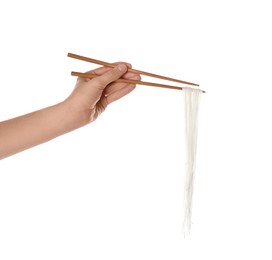 Photo of Woman holding cooked rice noodles with chopsticks on white background, closeup