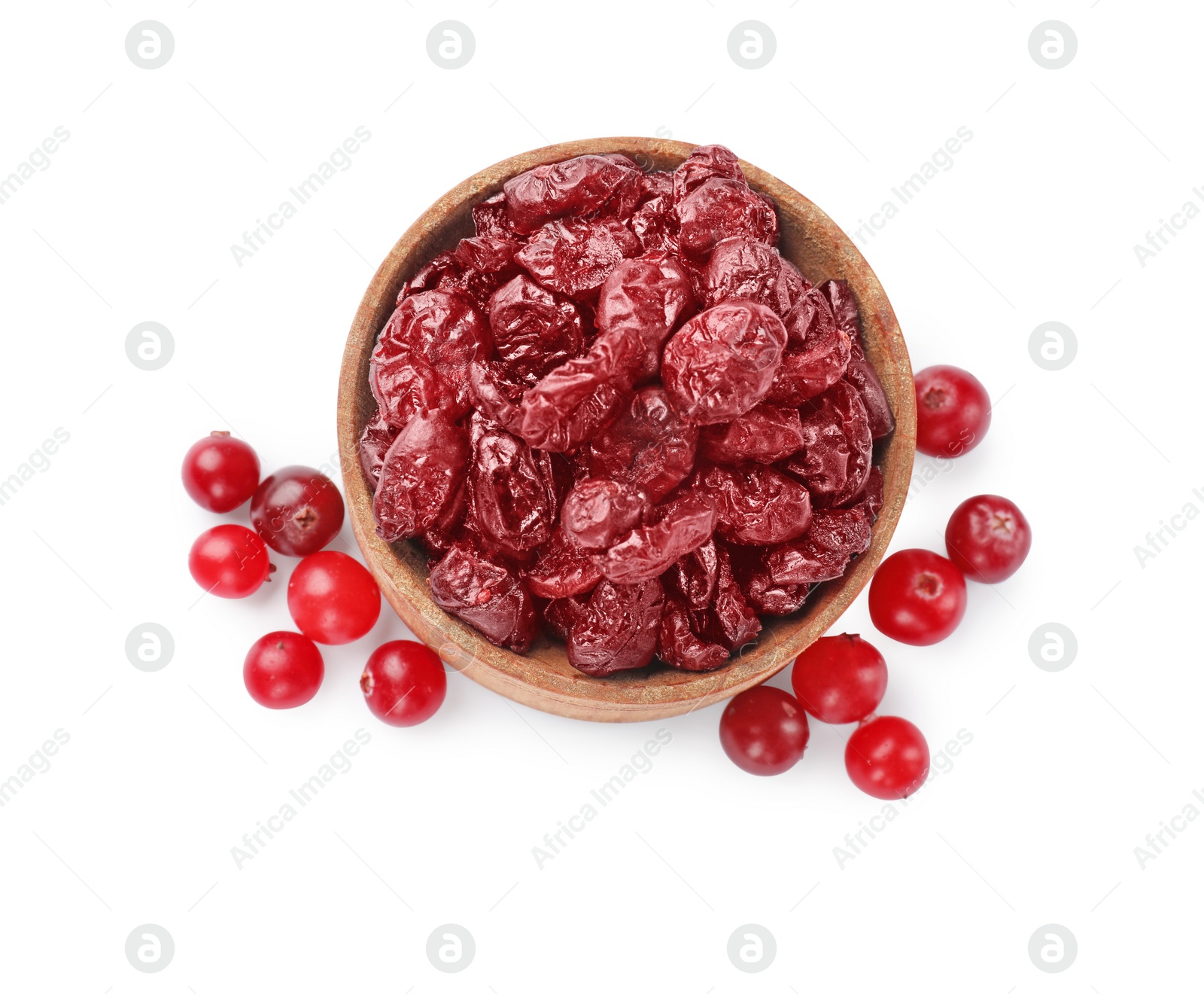 Photo of Tasty dried cranberries and bowl isolated on white, top view