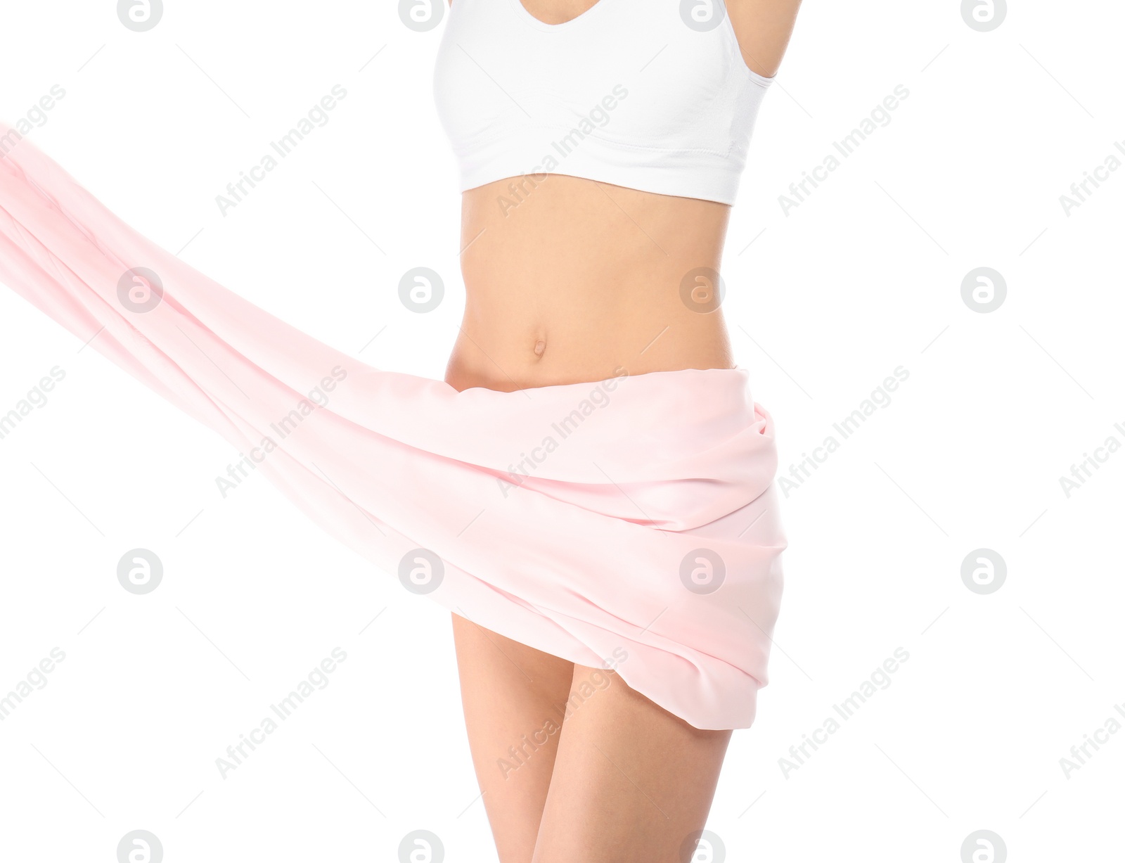 Photo of Young woman with perfect smooth skin and soft fabric on white background, closeup of belly. Beauty and body care