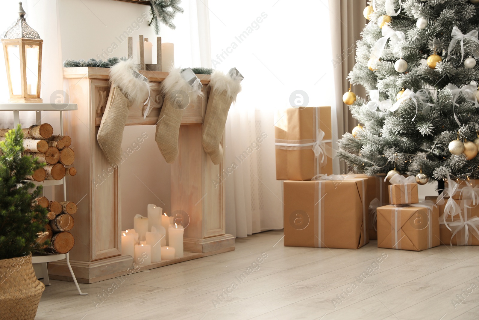 Photo of Stylish Christmas interior with beautiful decorated tree and fireplace