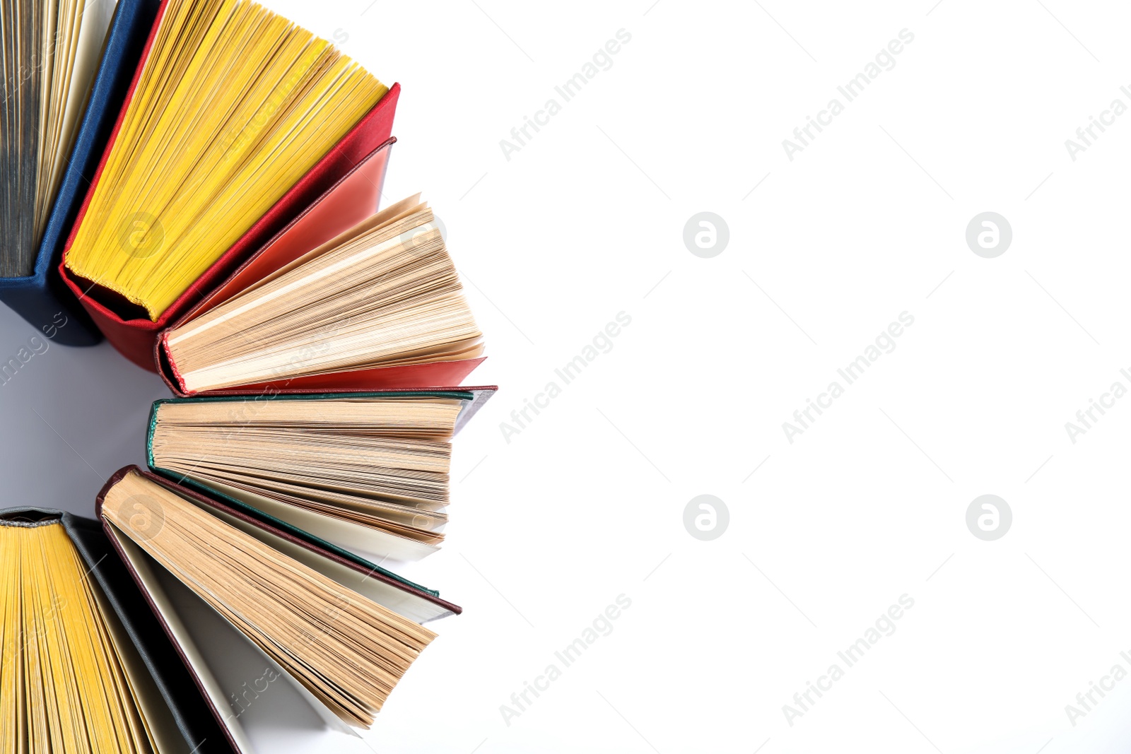 Photo of Hardcover books on white background, flat lay. Space for text