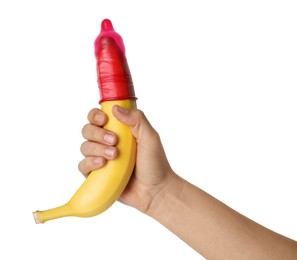 Photo of Woman holding banana in condom on white background, closeup. Safe sex concept