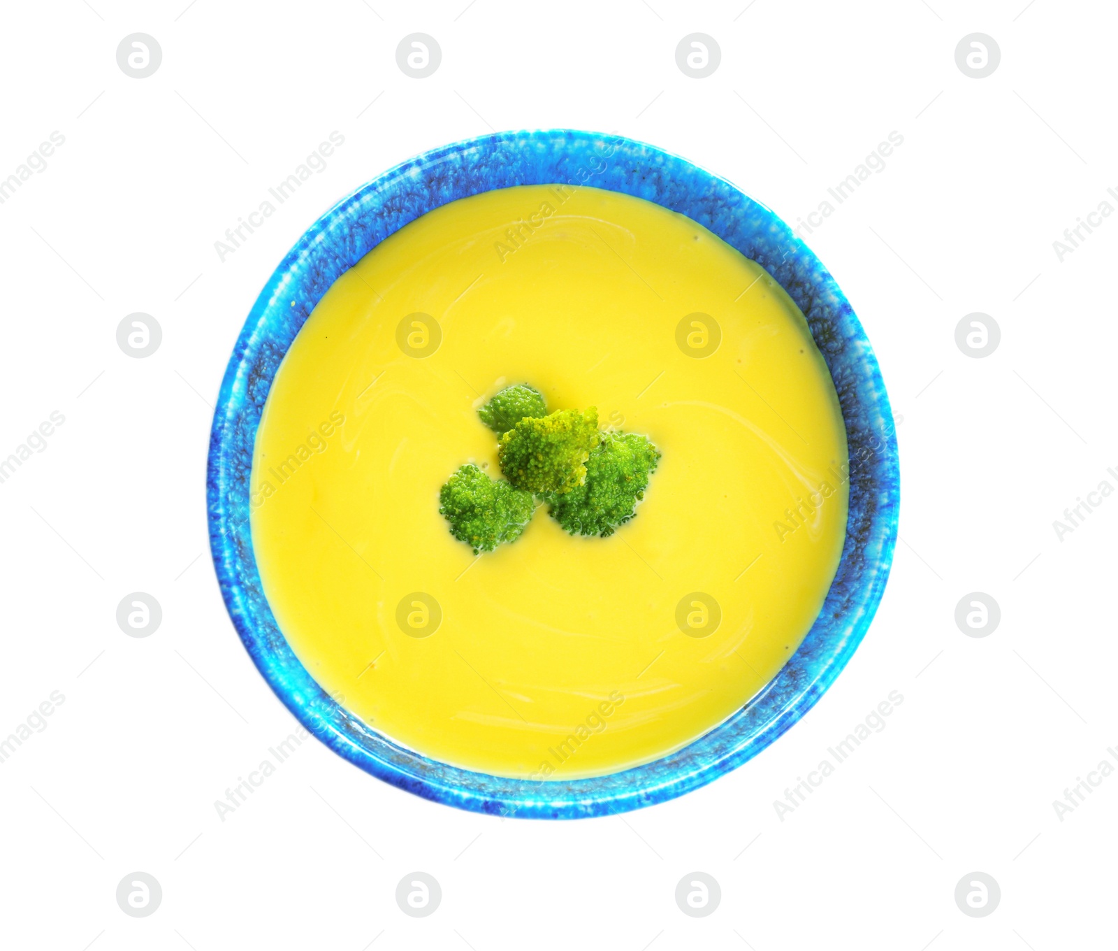 Photo of Bowl of cheese cream soup with broccoli on white background, top view