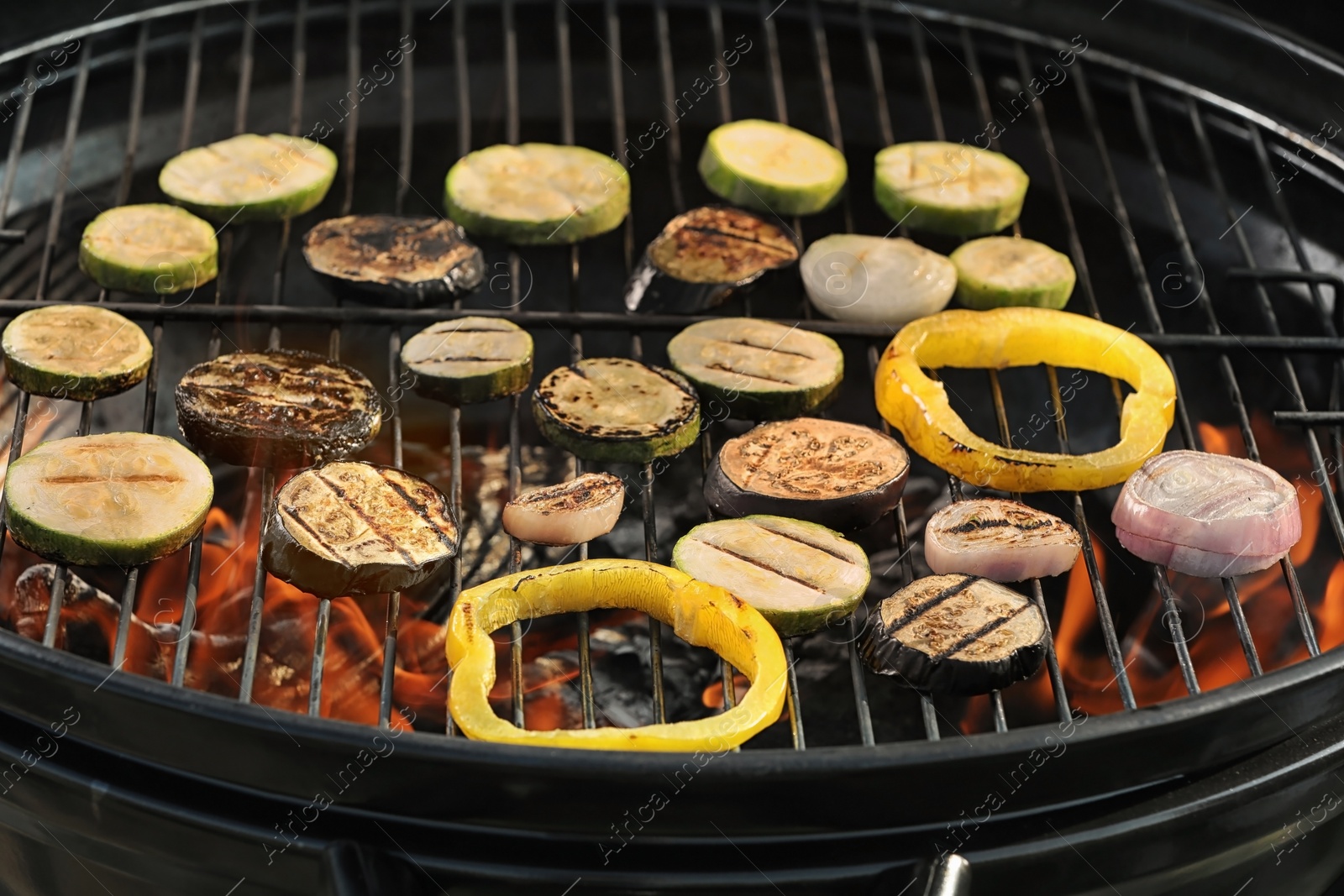 Photo of New modern barbecue grill with different vegetables, closeup