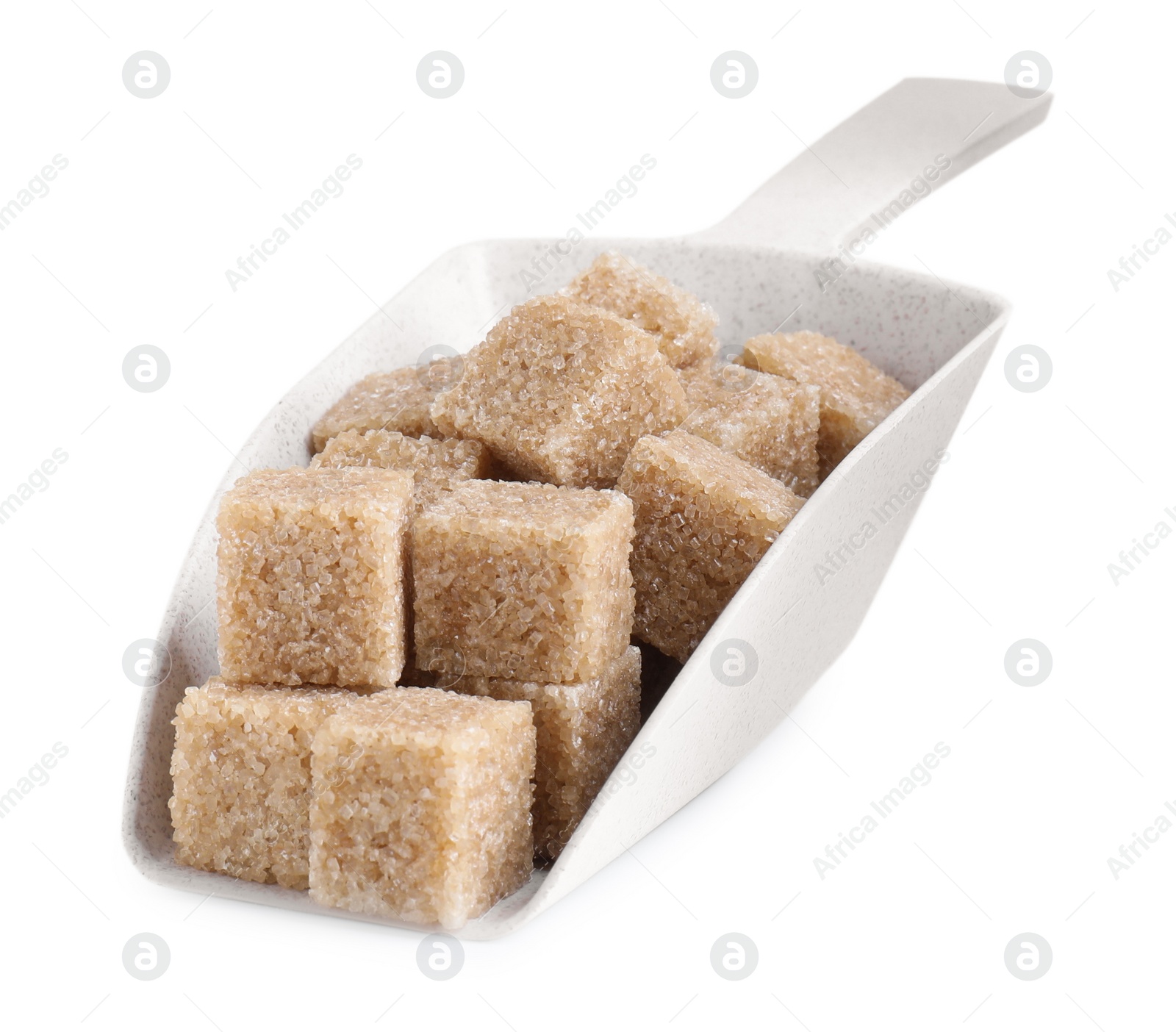 Photo of Brown sugar cubes in scoop isolated on white