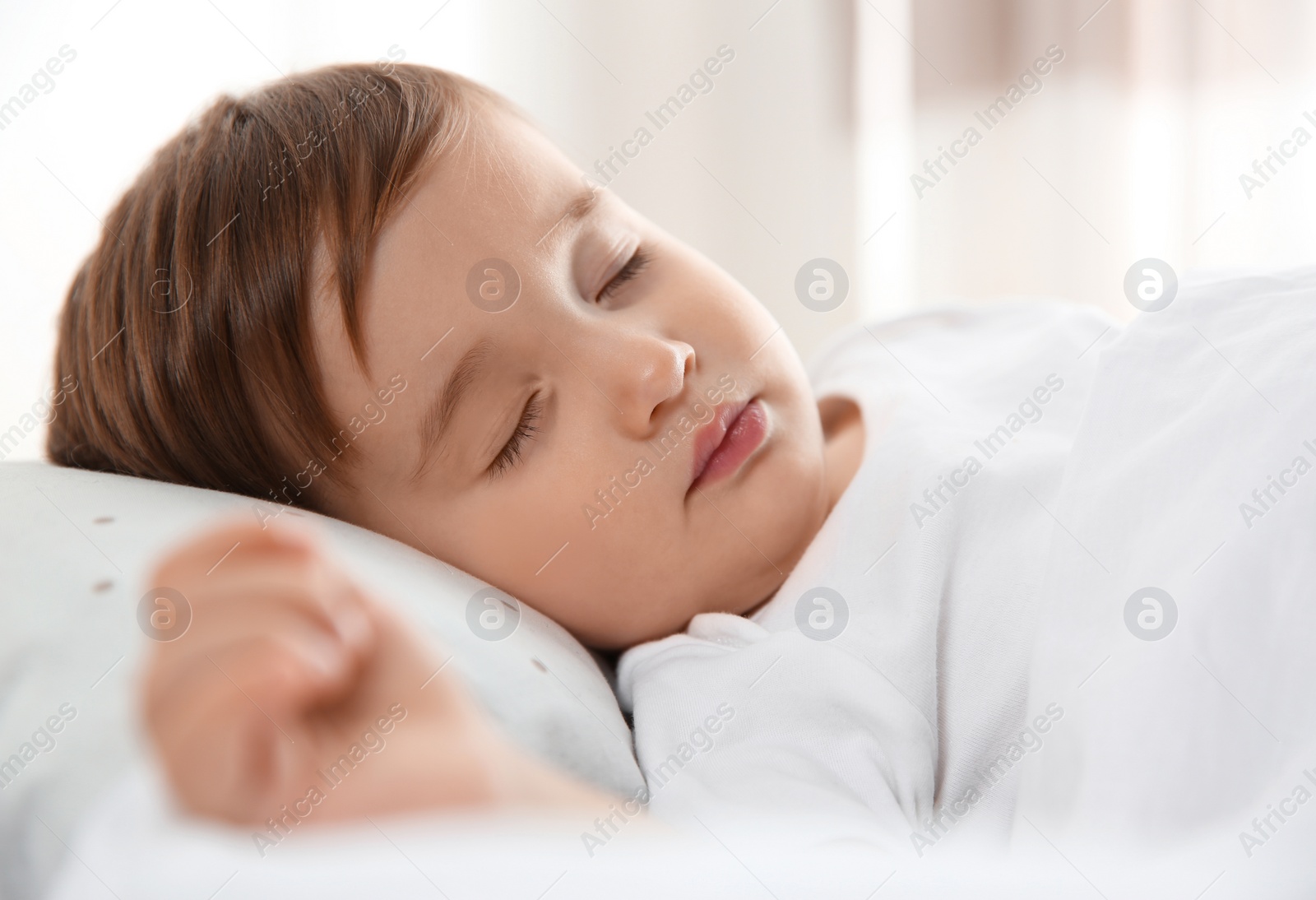 Photo of Cute little baby peacefully sleeping at home. Bedtime