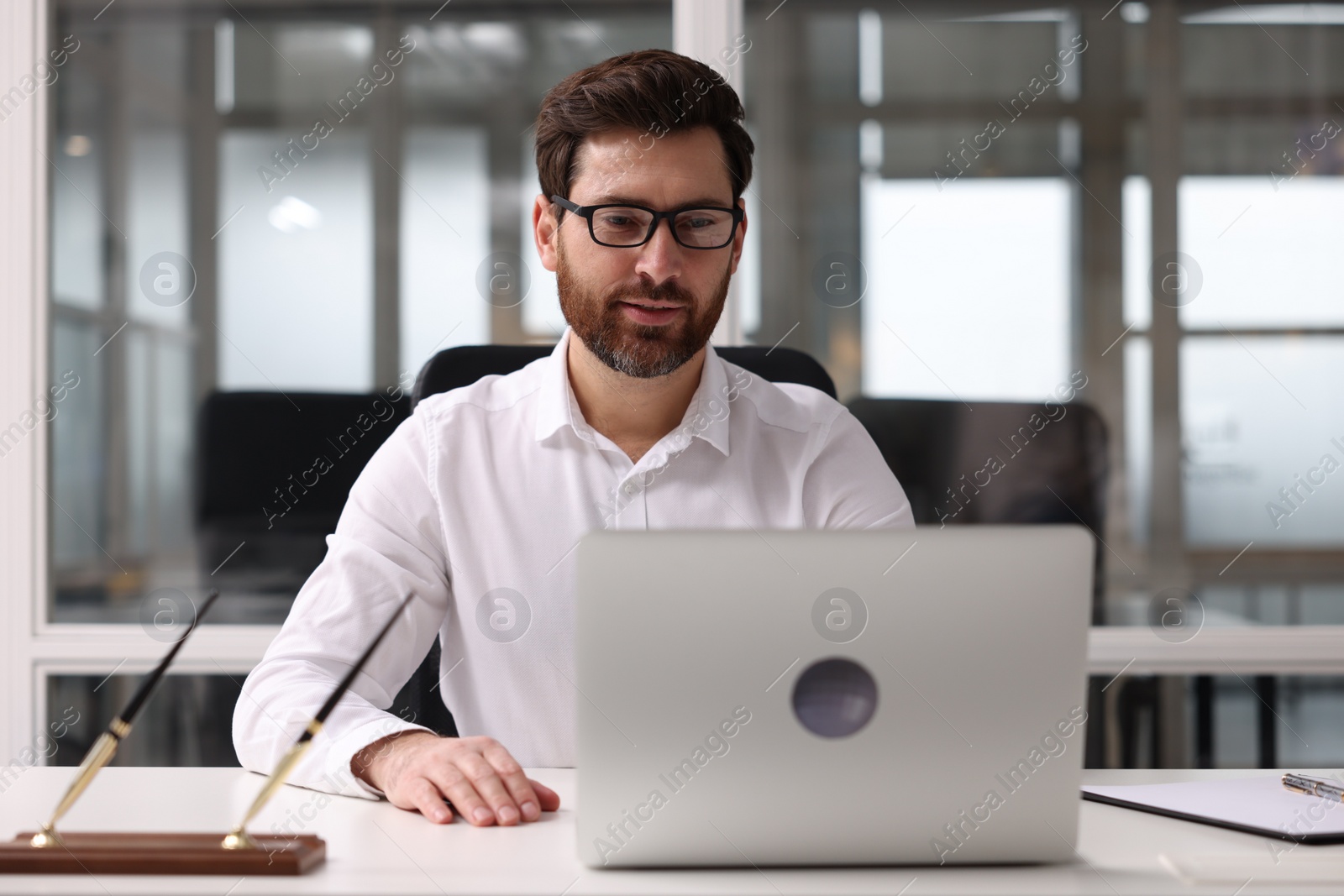 Photo of Portrait of serious man in office. Lawyer, businessman, accountant or manager