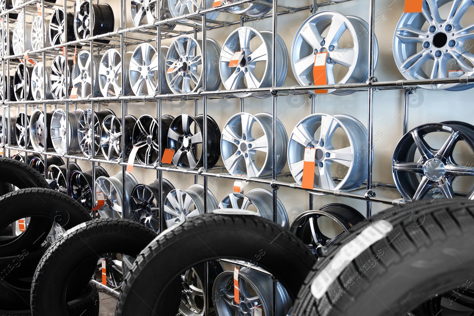 Photo of Car tires and alloy wheels in automobile service center