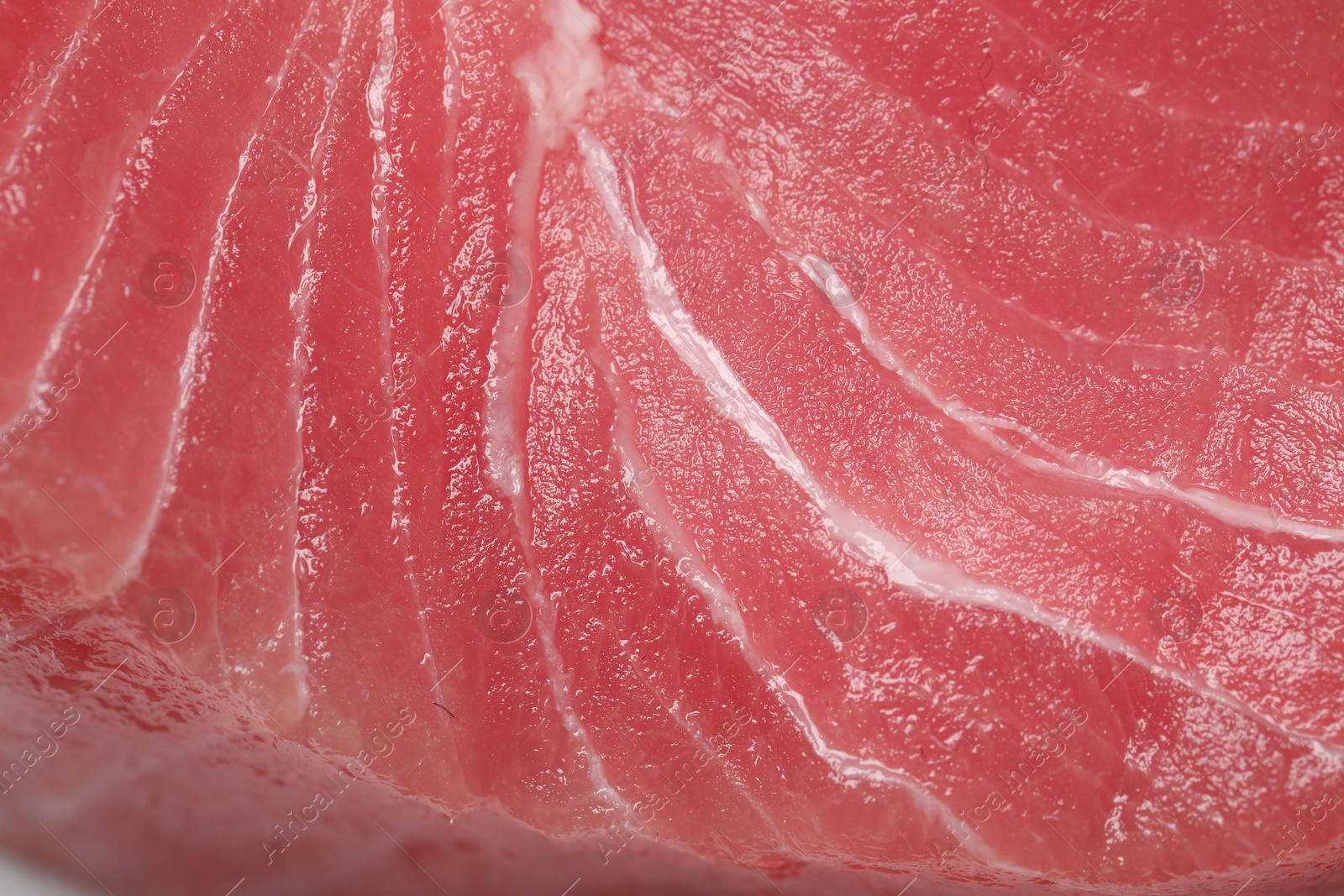 Photo of Texture of raw tuna fillet as background, closeup