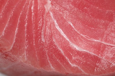 Texture of raw tuna fillet as background, closeup