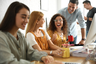 Photo of Team of professional designers working in office