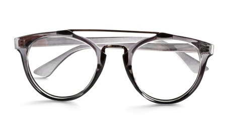 Photo of Glasses with corrective lenses on white background. Vision problem