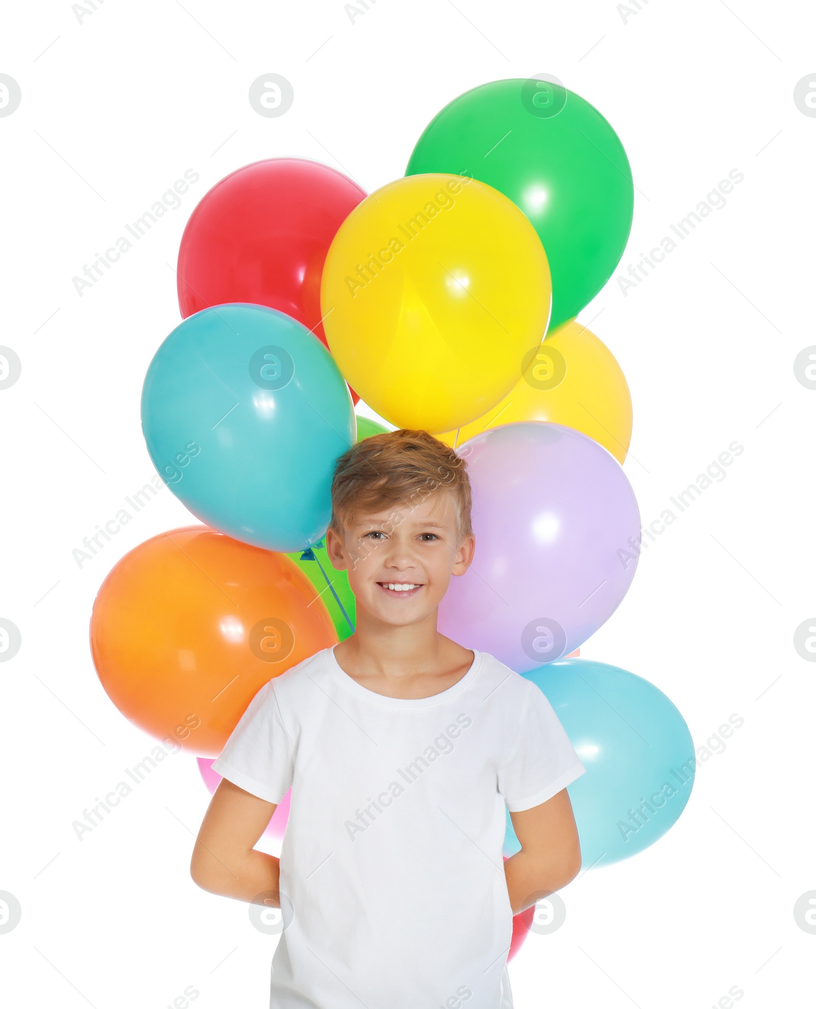 Photo of Little boy holding bunch of colorful balloons on white background