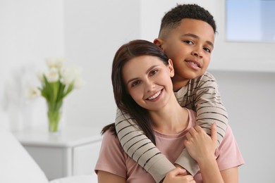 Mother with her African American son at home. International family