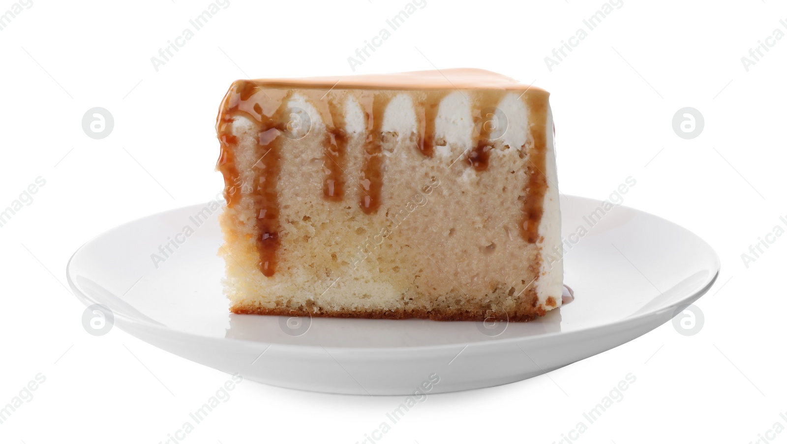 Photo of Slice of delicious cake with caramel sauce isolated on white