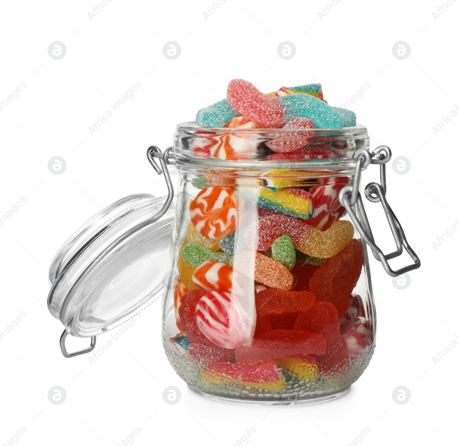 Photo of Many different candies in glass jar isolated on white