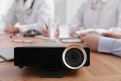 Photo of Video projector on table during medical conference