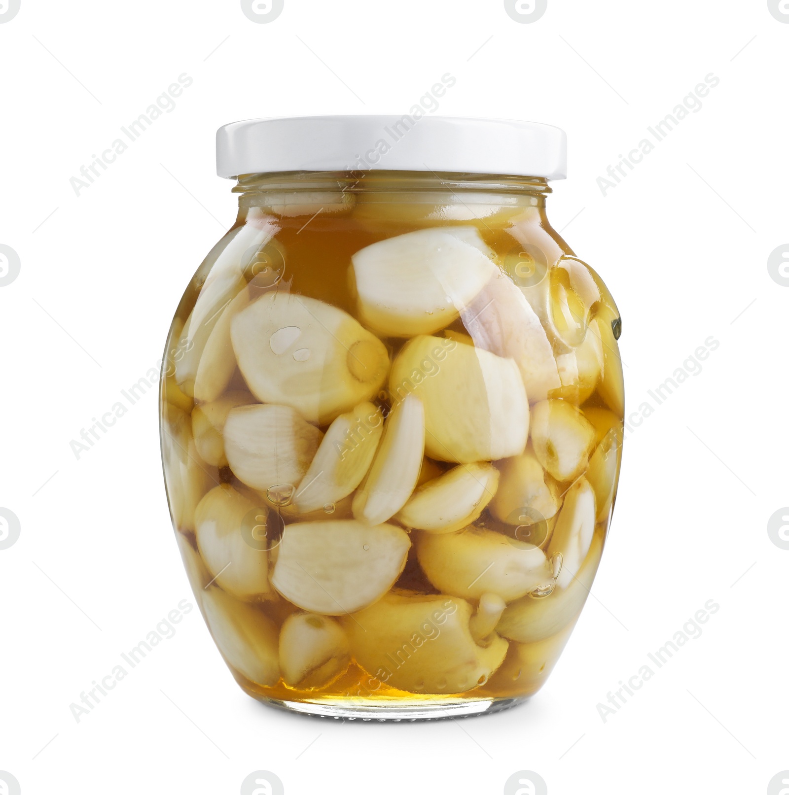 Photo of Garlic with honey in glass jar isolated on white