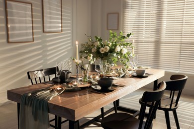 Photo of Festive table setting with beautiful tableware and decor indoors