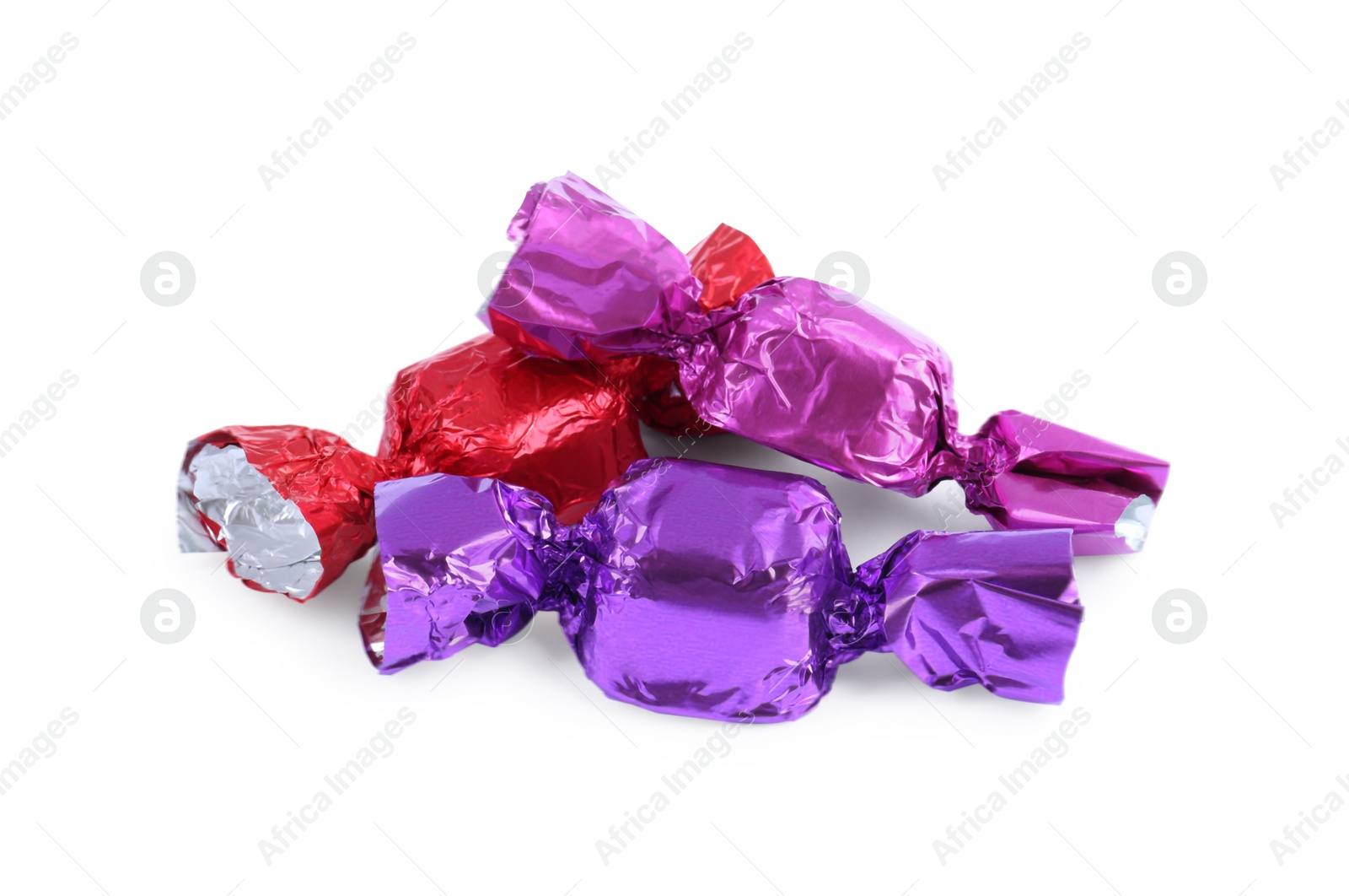 Photo of Tasty candies in colorful wrappers isolated on white