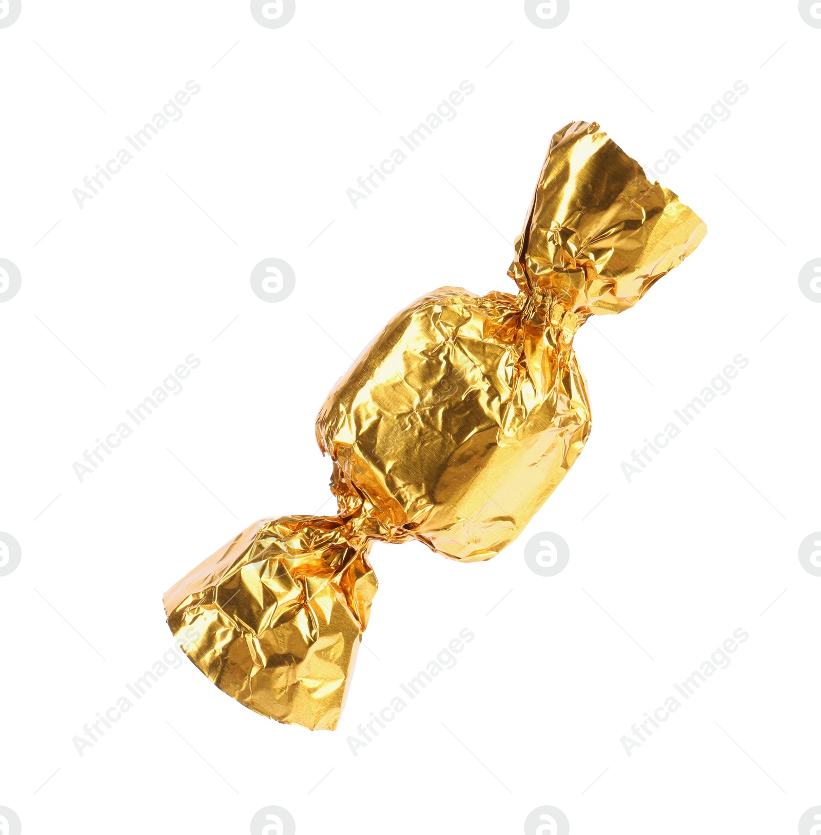 Photo of Tasty candy in golden wrapper isolated on white