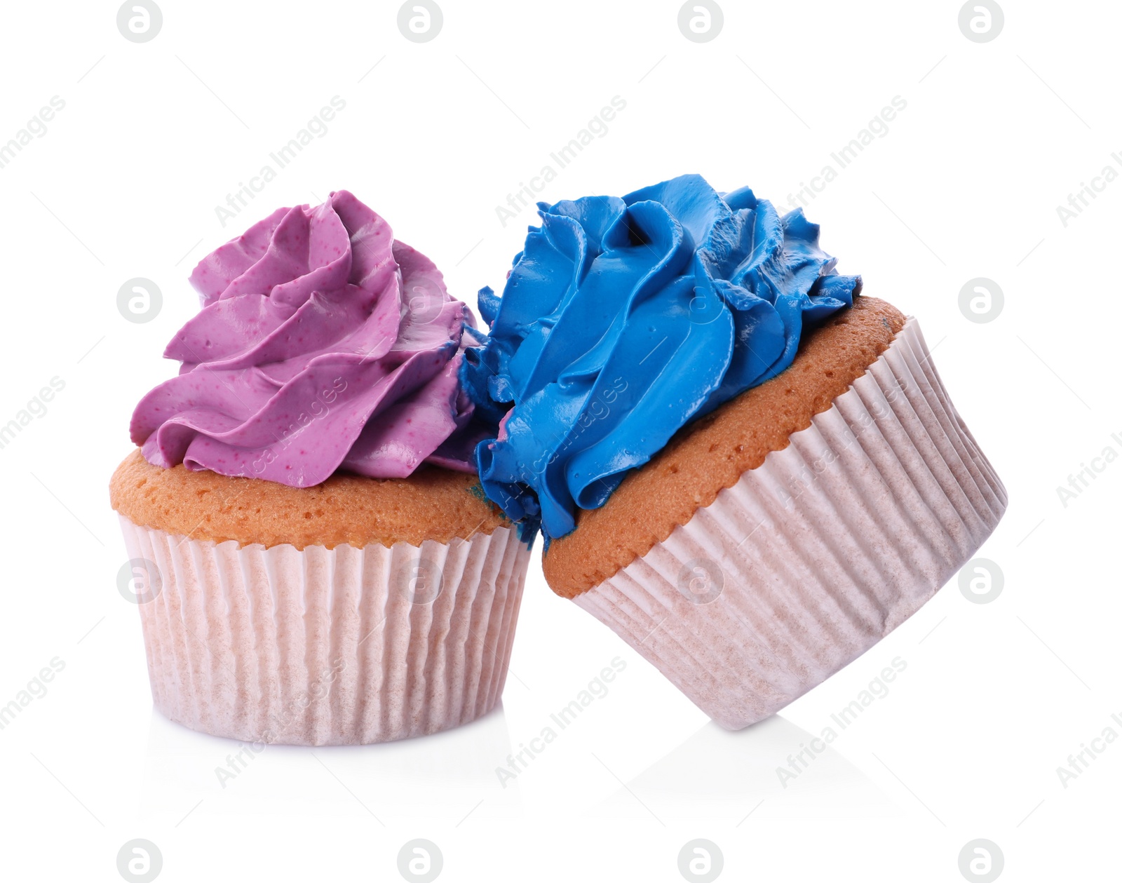 Photo of Two failed cupcakes with cream on white background. Troubles happen