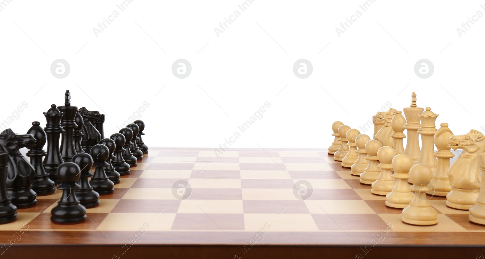 Photo of Chess pieces on wooden board against white background