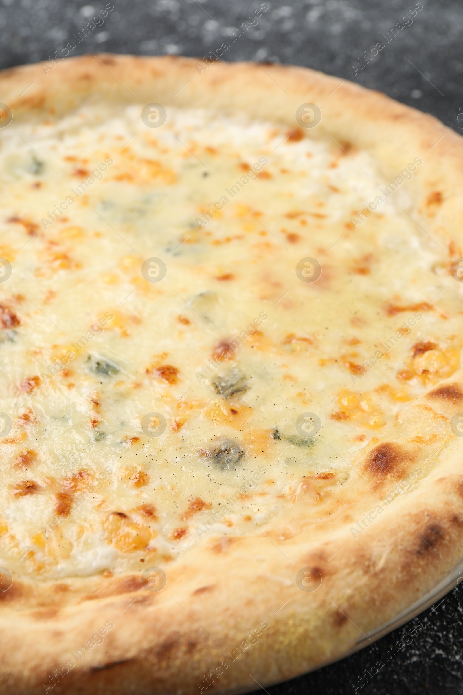 Photo of Delicious cheese pizza on table, closeup view