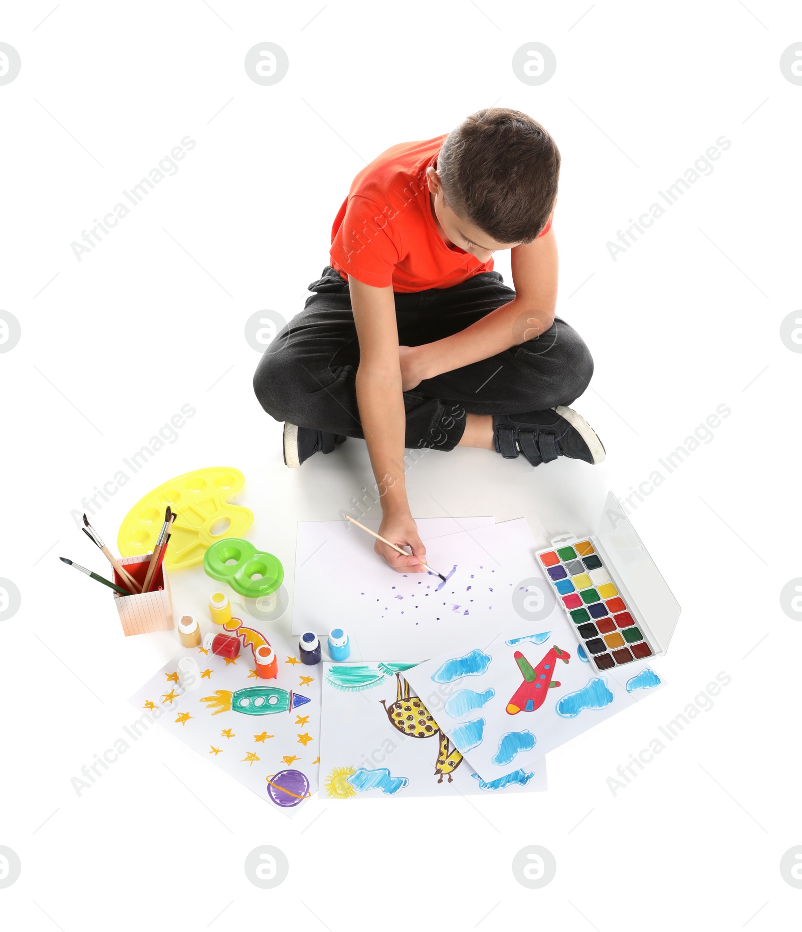 Photo of Cute child painting picture on white background